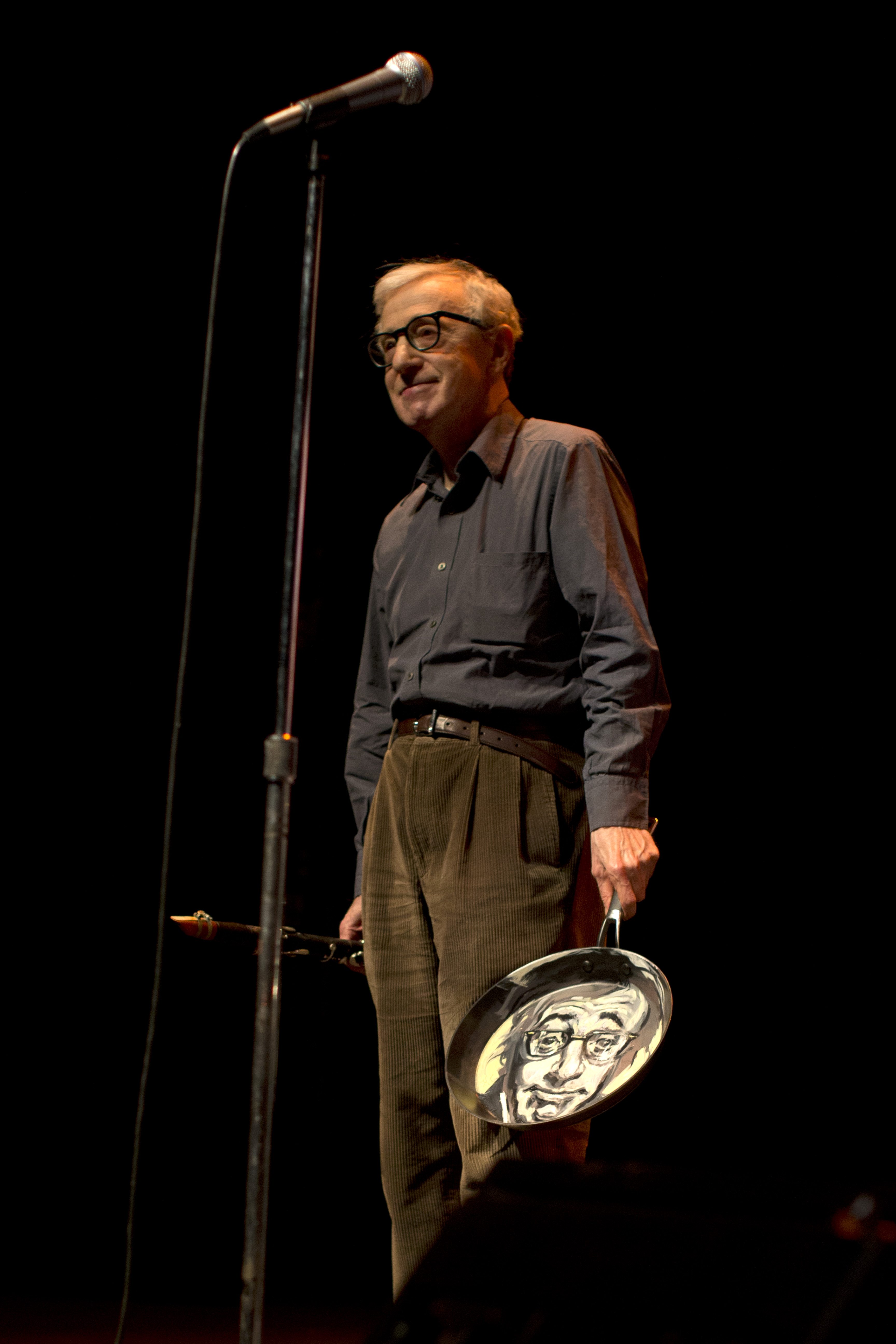 Woody Allen receives a portrait of himself on a frying pan at his Jazz concert at Royce Hall in Los Angeles.